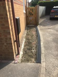New drainage channels on a tarmac path