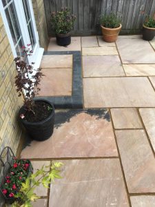 completed patio in oxford with block bricks and sandstone flags